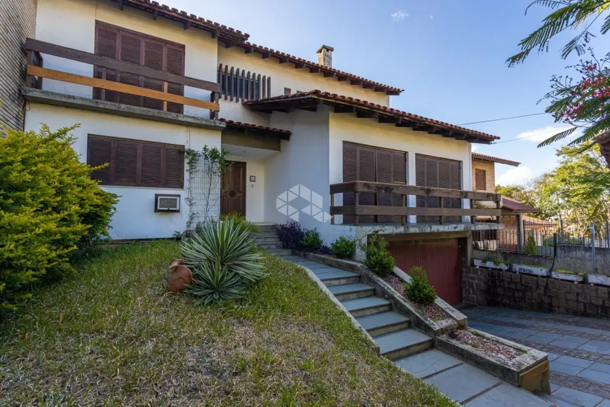 Foto 1 de Casa com 4 Quartos à venda, 413m² em Nonoai, Porto Alegre