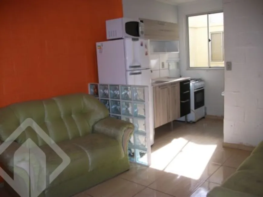 Foto 1 de Apartamento com 2 Quartos à venda, 38m² em Vila Nova, Porto Alegre