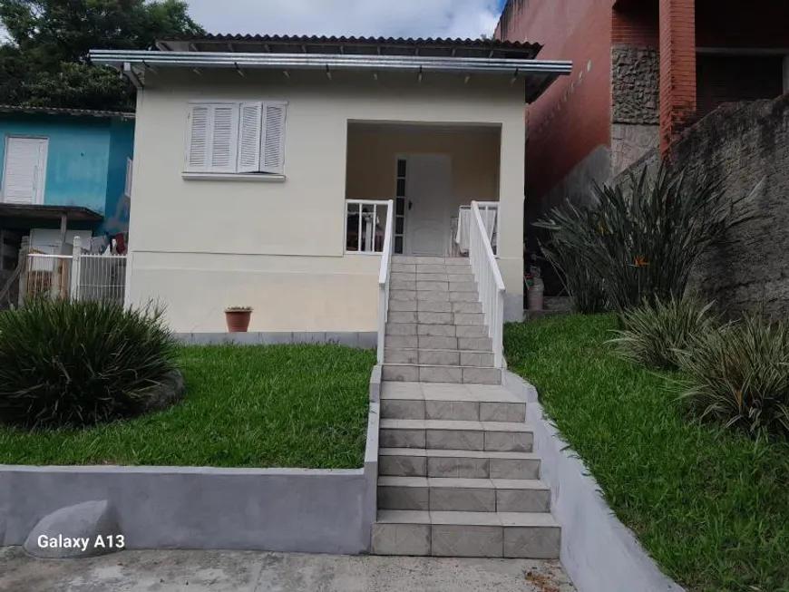 Foto 1 de Casa com 2 Quartos à venda, 91m² em Vila Nova, Porto Alegre