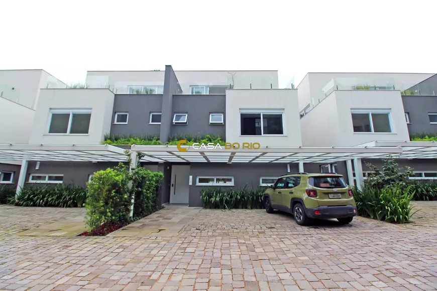 Foto 1 de Casa de Condomínio com 3 Quartos à venda, 438m² em Pedra Redonda, Porto Alegre