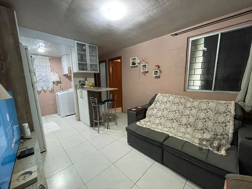 Foto 1 de Apartamento com 2 Quartos à venda, 41m² em Vila Nova, Porto Alegre