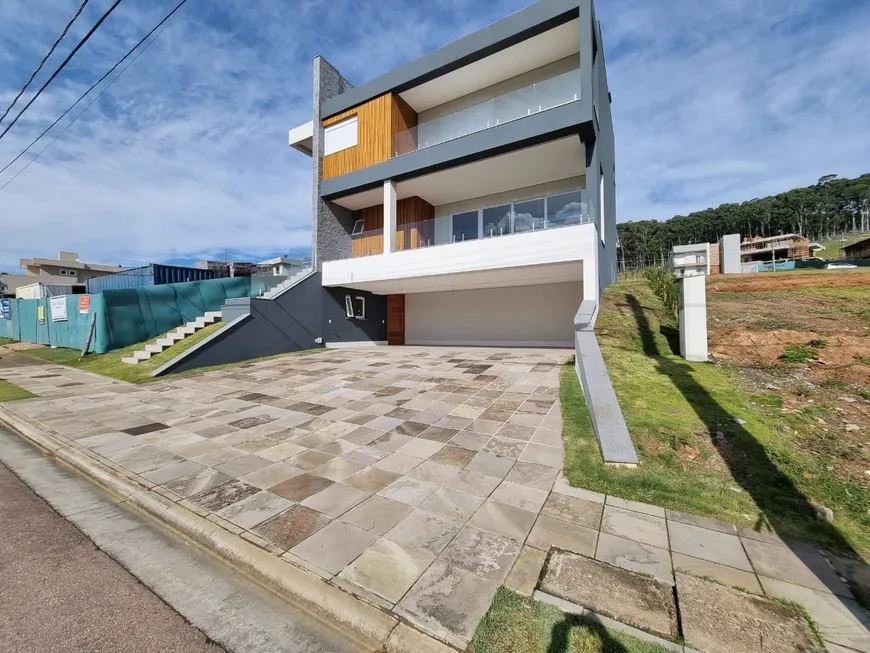 Foto 1 de Casa de Condomínio com 4 Quartos à venda, 396m² em Vila Nova, Porto Alegre
