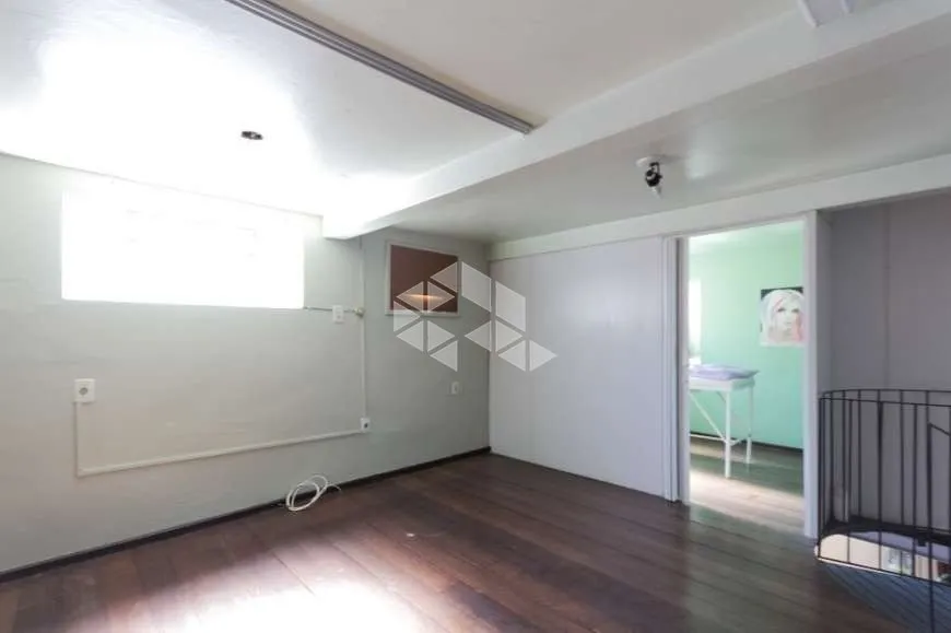 Foto 1 de Casa com 4 Quartos à venda, 170m² em Rio Branco, Porto Alegre