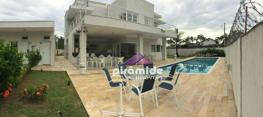 Foto 1 de Casa com 4 Quartos para venda ou aluguel, 450m² em Praia Das Palmeiras, Caraguatatuba