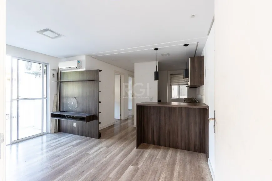 Foto 1 de Apartamento com 2 Quartos à venda, 49m² em Vila Nova, Porto Alegre