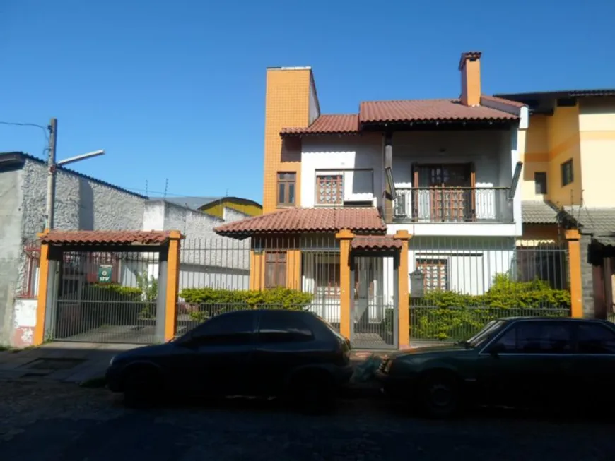 Foto 1 de Casa com 6 Quartos à venda, 399m² em Santo Antônio, Porto Alegre