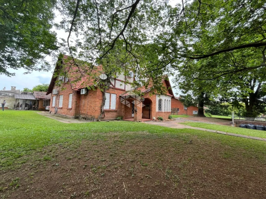 Foto 1 de Casa com 4 Quartos à venda, 480m² em Vila Assunção, Porto Alegre