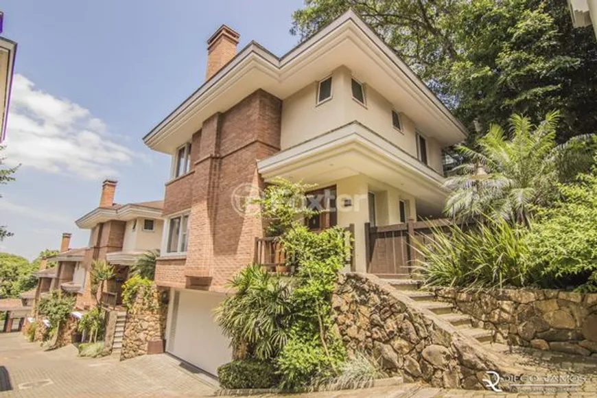 Foto 1 de Casa de Condomínio com 3 Quartos à venda, 342m² em Pedra Redonda, Porto Alegre