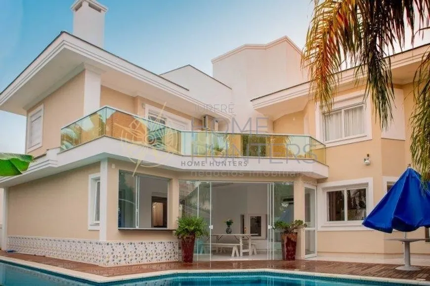 Foto 1 de Casa com 4 Quartos para alugar, 420m² em Jurerê Internacional, Florianópolis