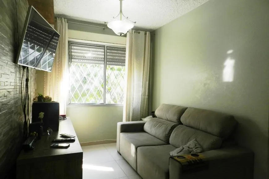 Foto 1 de Apartamento com 3 Quartos à venda, 68m² em Vila Nova, Porto Alegre