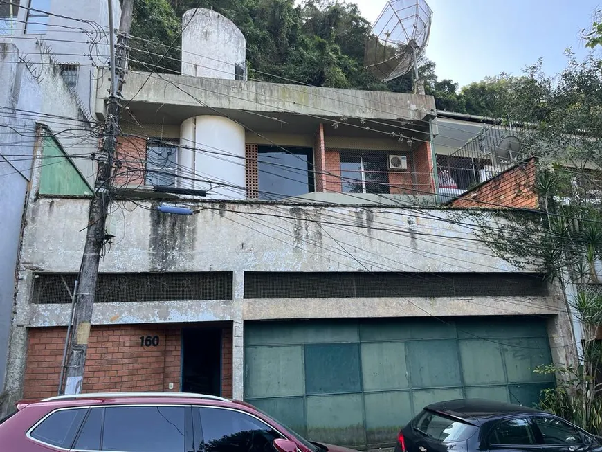 Foto 1 de Casa de Condomínio com 5 Quartos à venda, 500m² em Cosme Velho, Rio de Janeiro