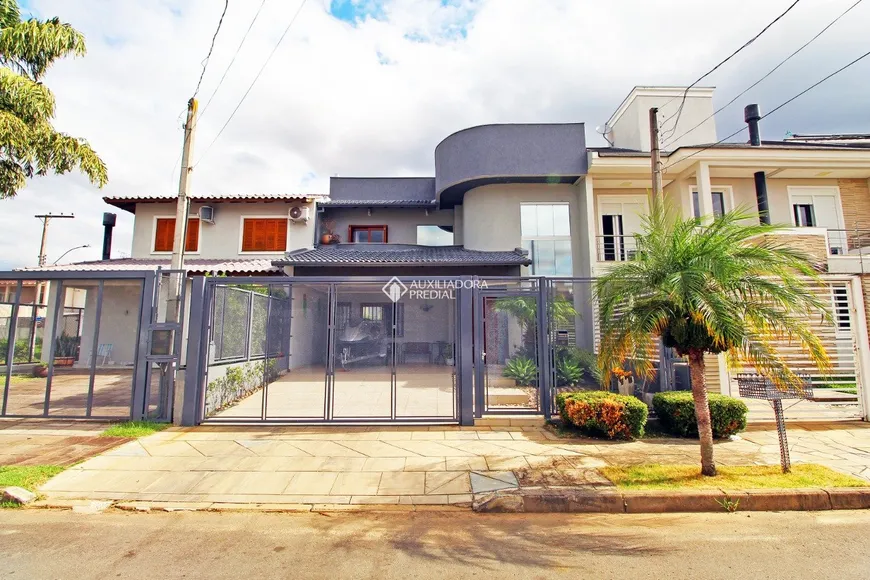 Foto 1 de Casa de Condomínio com 4 Quartos à venda, 216m² em Alto Petrópolis, Porto Alegre