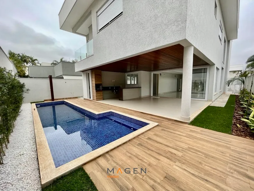 Foto 1 de Casa de Condomínio com 5 Quartos à venda, 343m² em Jardins Valencia, Goiânia