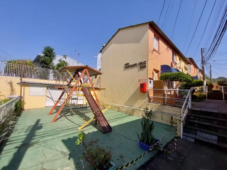 Foto 1 de Casa de Condomínio com 2 Quartos à venda, 58m² em Santo Antônio, Porto Alegre