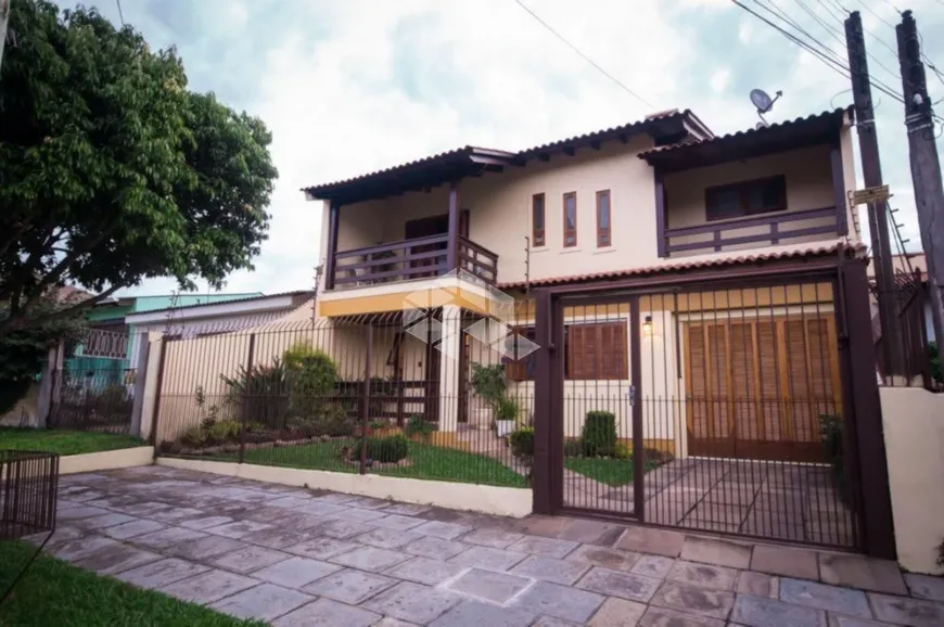 Foto 1 de Casa com 4 Quartos à venda, 242m² em Cavalhada, Porto Alegre