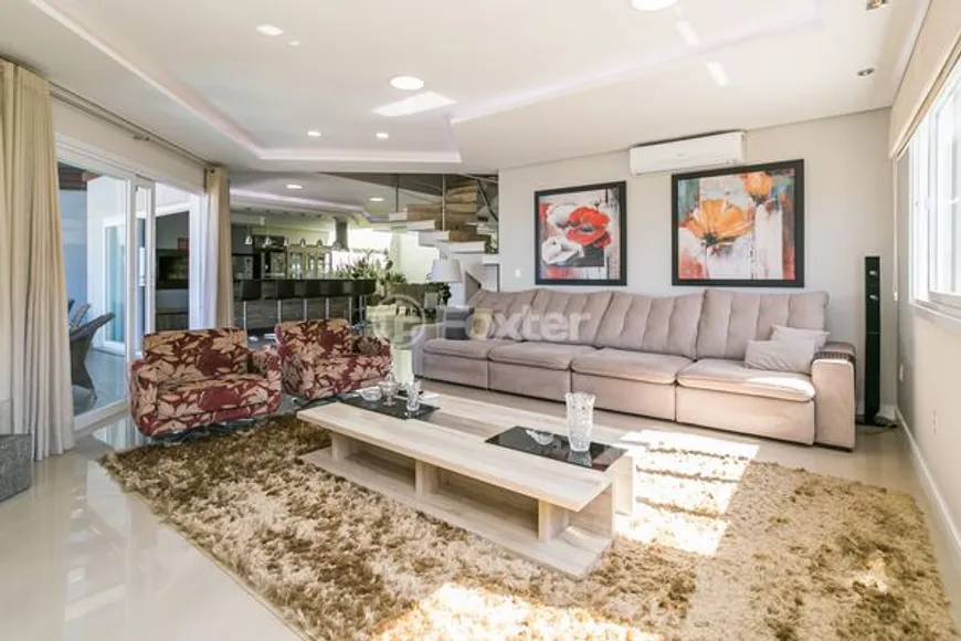 Foto 1 de Casa de Condomínio com 3 Quartos à venda, 250m² em Hípica, Porto Alegre