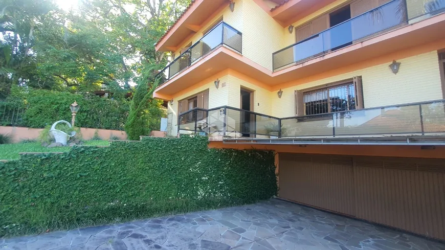 Foto 1 de Casa com 5 Quartos à venda, 400m² em Tristeza, Porto Alegre