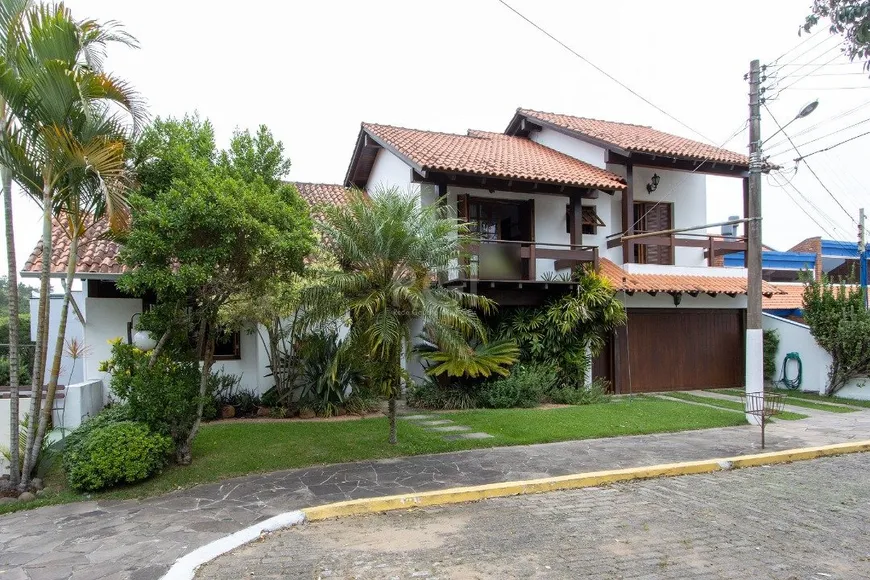 Foto 1 de Casa de Condomínio com 4 Quartos à venda, 183m² em Espiríto Santo, Porto Alegre