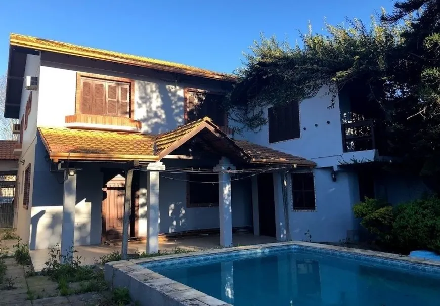 Foto 1 de Casa com 4 Quartos à venda, 364m² em Partenon, Porto Alegre