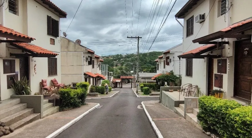 Foto 1 de Casa de Condomínio com 2 Quartos à venda, 73m² em Vila Nova, Porto Alegre