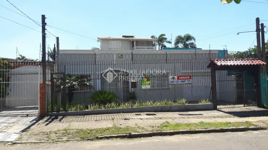 Foto 1 de Casa com 5 Quartos à venda, 90m² em Santa Fé, Porto Alegre