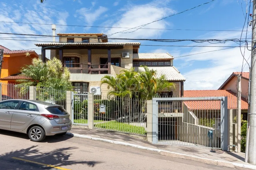 Foto 1 de Casa de Condomínio com 4 Quartos à venda, 424m² em Nonoai, Porto Alegre