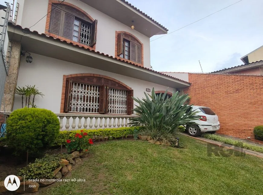 Foto 1 de Casa com 4 Quartos à venda, 243m² em Cavalhada, Porto Alegre