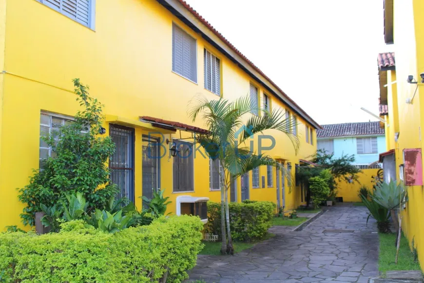 Foto 1 de Casa de Condomínio com 2 Quartos à venda, 46m² em Vila Nova, Porto Alegre