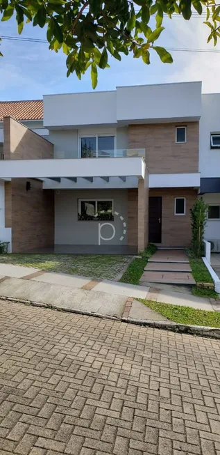Foto 1 de Casa de Condomínio com 3 Quartos à venda, 200m² em Vila Nova, Porto Alegre