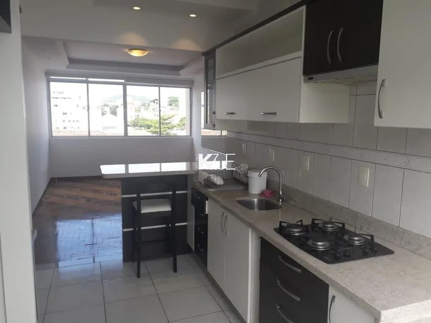 Foto 1 de Apartamento com 2 Quartos à venda, 63m² em Coqueiros, Florianópolis