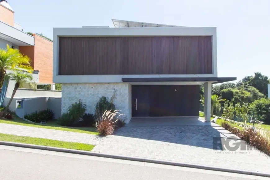 Foto 1 de Casa de Condomínio com 4 Quartos à venda, 289m² em Vila Nova, Porto Alegre