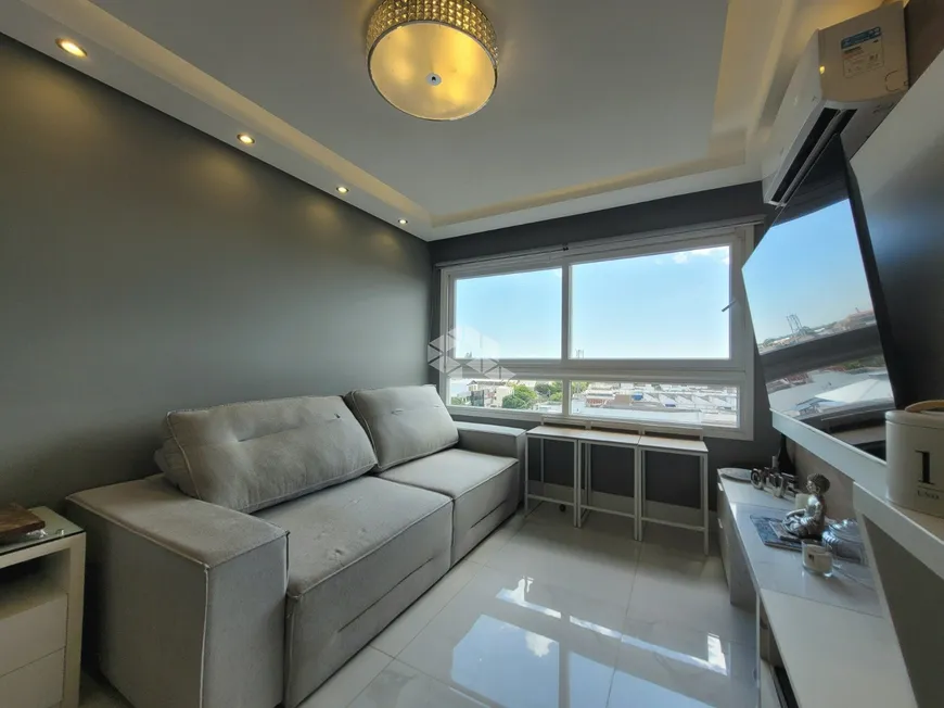 Foto 1 de Apartamento com 3 Quartos à venda, 77m² em Navegantes, Porto Alegre