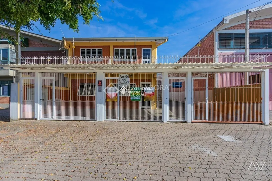 Foto 1 de Casa com 7 Quartos à venda, 219m² em Anchieta, Porto Alegre