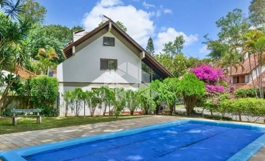 Foto 1 de Casa de Condomínio com 5 Quartos à venda, 221m² em Ipanema, Porto Alegre