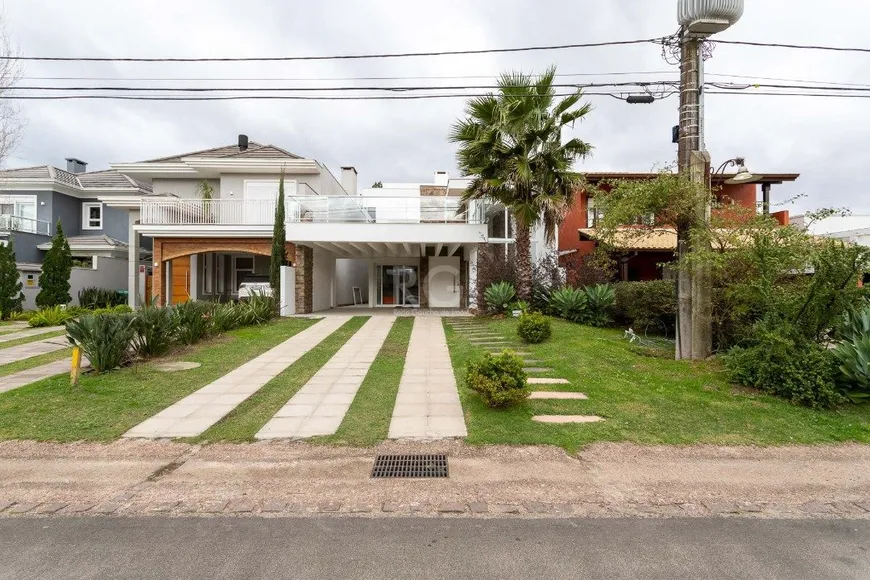 Foto 1 de Casa de Condomínio com 5 Quartos à venda, 293m² em Belém Novo, Porto Alegre