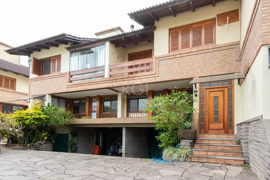 Foto 1 de Casa de Condomínio com 4 Quartos à venda, 215m² em Tristeza, Porto Alegre