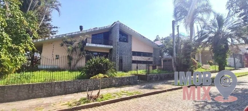 Foto 1 de Casa com 4 Quartos para alugar, 500m² em Jardim Lindóia, Porto Alegre