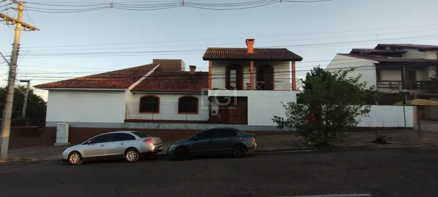 Foto 1 de Casa com 4 Quartos à venda, 379m² em Santa Fé, Porto Alegre