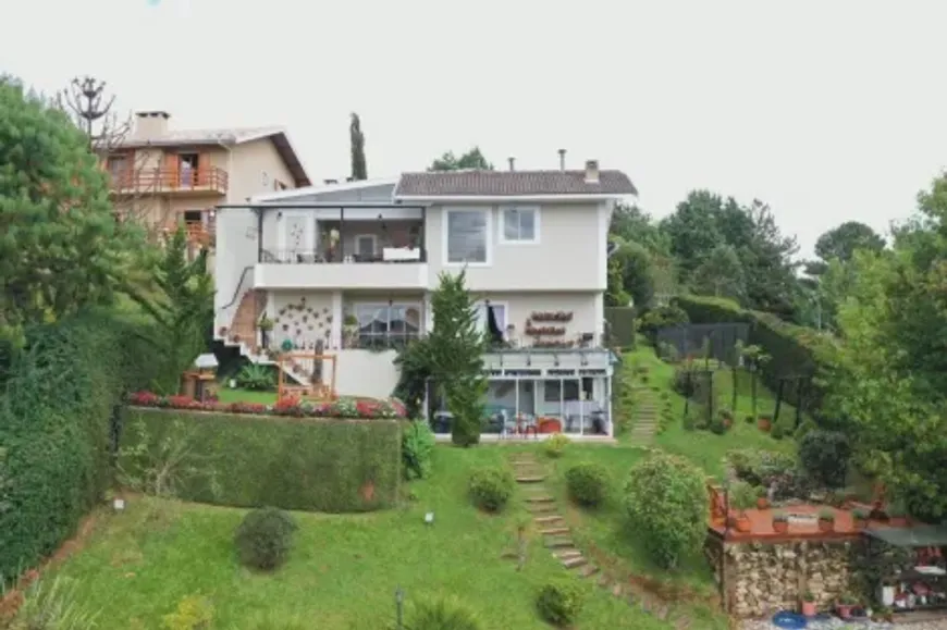 Foto 1 de Casa de Condomínio com 4 Quartos à venda, 320m² em Capivari, Campos do Jordão