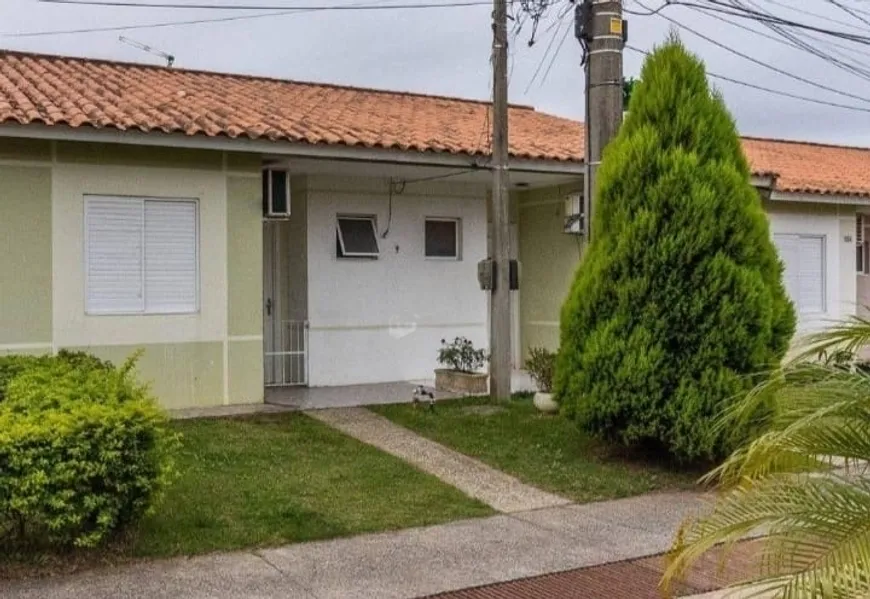 Foto 1 de Casa de Condomínio com 3 Quartos à venda, 43m² em Jardim Algarve, Alvorada