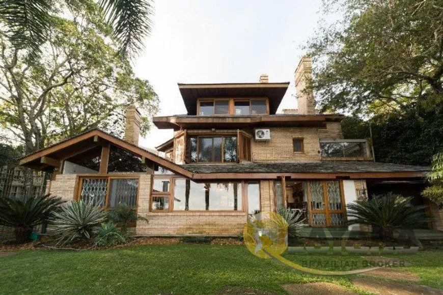 Foto 1 de Casa com 3 Quartos para alugar, 400m² em Pedra Redonda, Porto Alegre