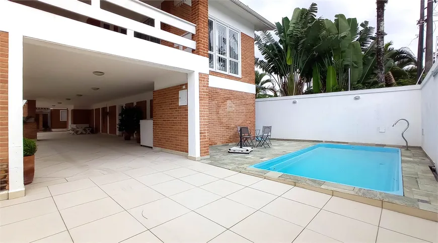 Foto 1 de Casa com 5 Quartos à venda, 346m² em Balneário Praia do Pernambuco, Guarujá