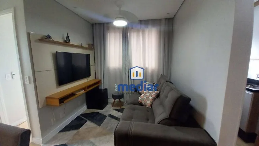 Foto 1 de Apartamento com 2 Quartos à venda, 46m² em Areia Branca, Santos