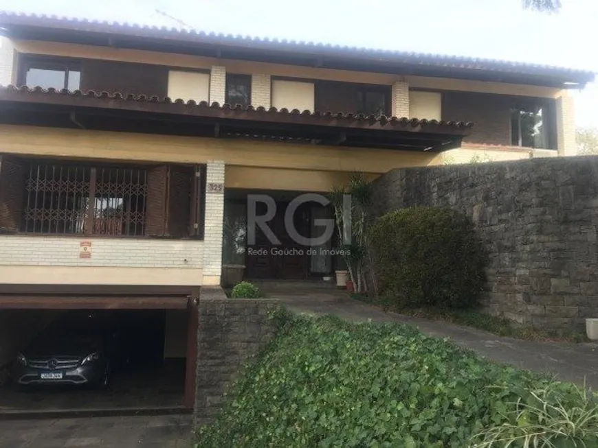 Foto 1 de Casa com 3 Quartos à venda, 405m² em Três Figueiras, Porto Alegre