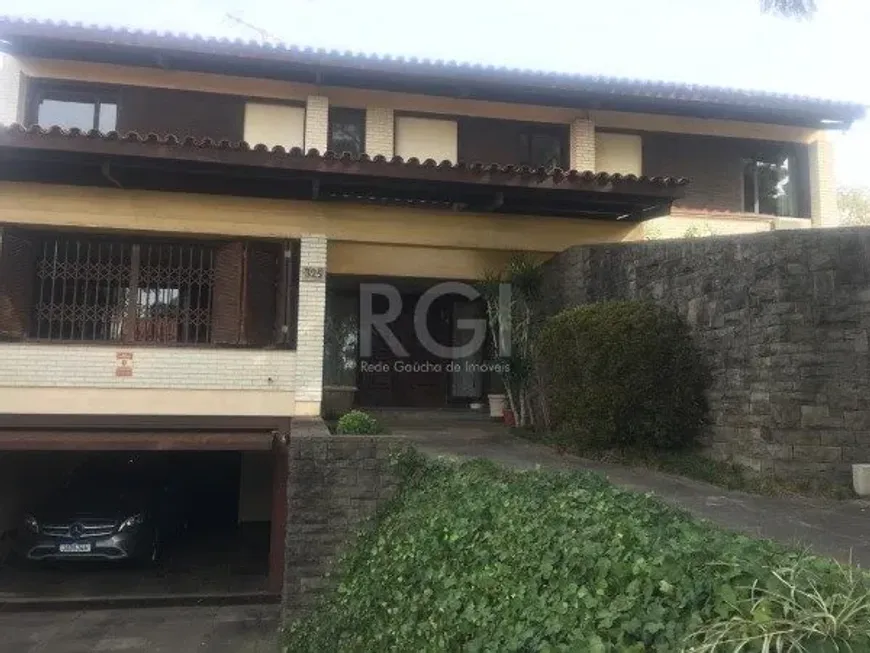 Foto 1 de Casa com 3 Quartos à venda, 407m² em Três Figueiras, Porto Alegre