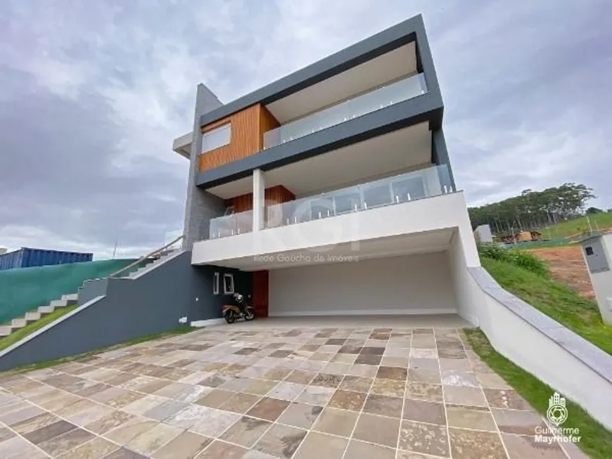 Foto 1 de Casa de Condomínio com 4 Quartos à venda, 357m² em Vila Nova, Porto Alegre