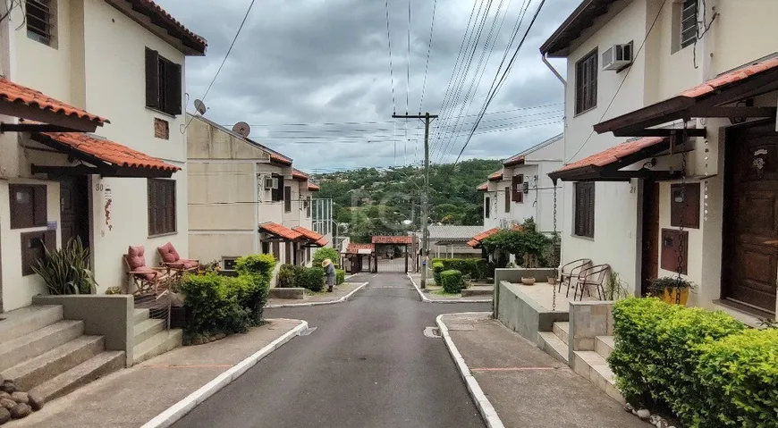 Foto 1 de Casa de Condomínio com 3 Quartos à venda, 71m² em Vila Nova, Porto Alegre