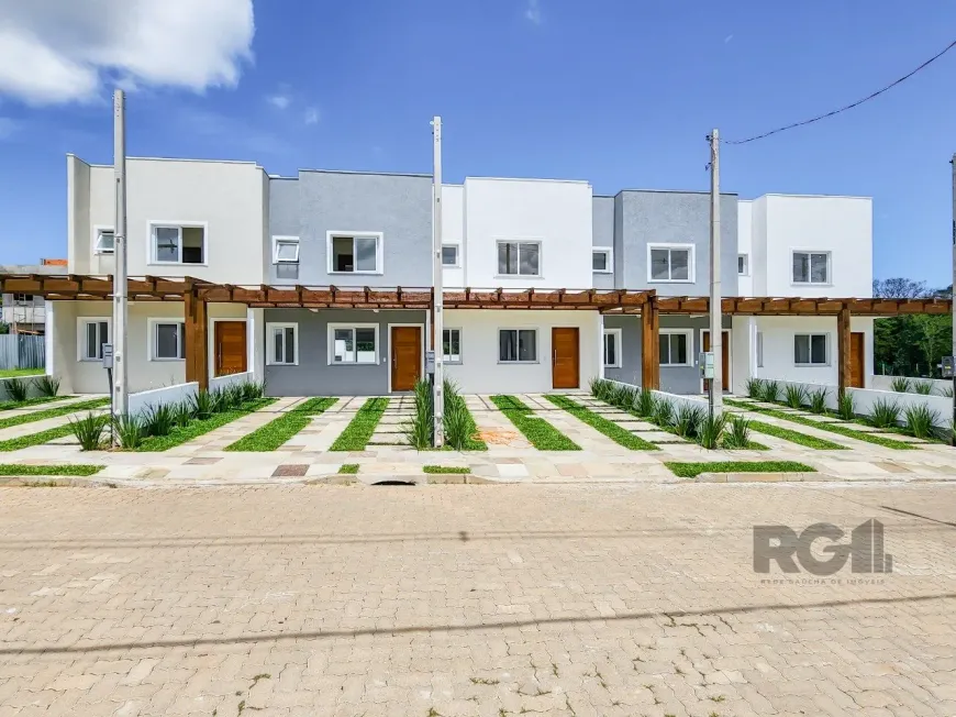 Foto 1 de Casa de Condomínio com 3 Quartos à venda, 92m² em Campo Novo, Porto Alegre