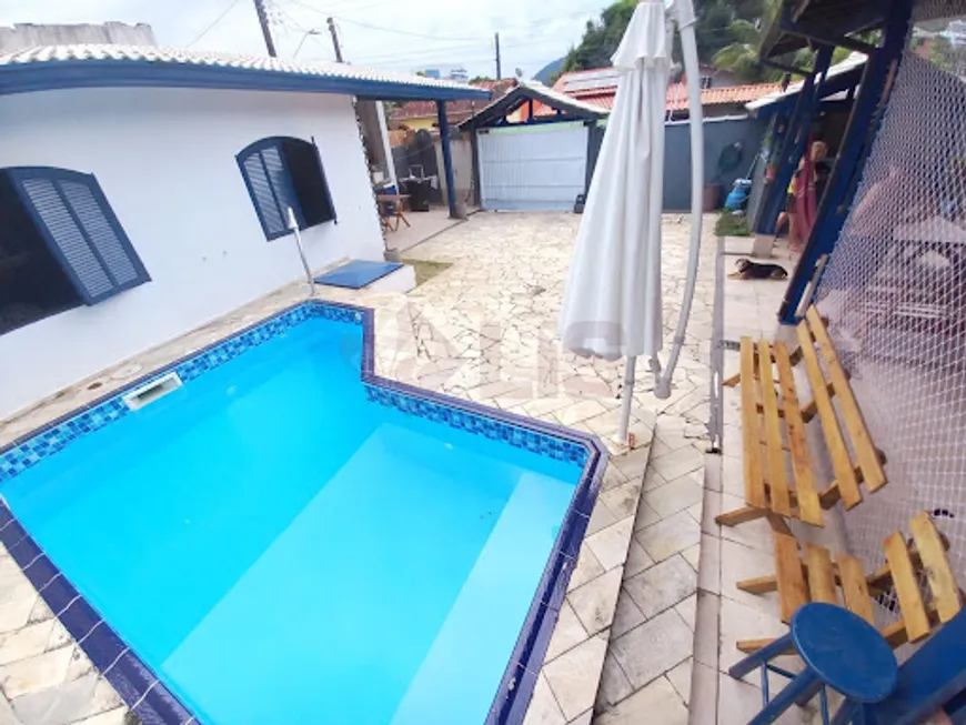 Foto 1 de Casa com 4 Quartos à venda, 275m² em Martim de Sa, Caraguatatuba