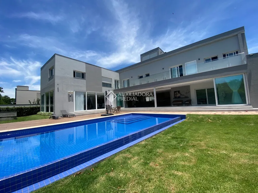 Foto 1 de Casa de Condomínio com 6 Quartos à venda, 943m² em Cacupé, Florianópolis